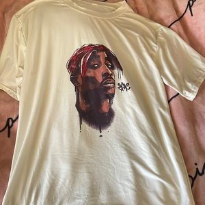 tupac shirt! cream like color all around with tupac in the middle. worn once!